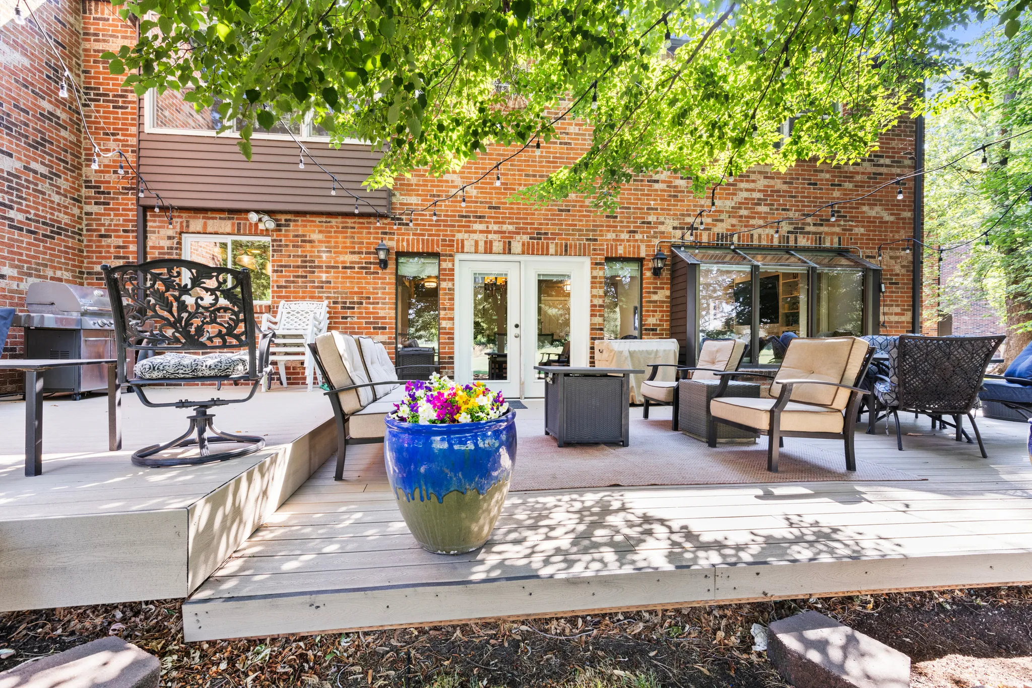 Expansive multi-level composite deck with brick exterior