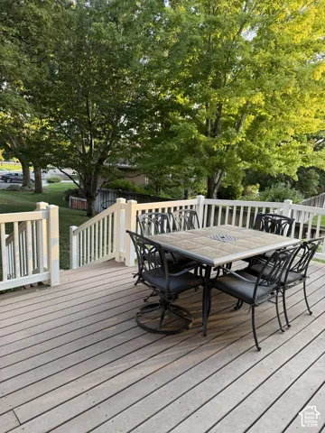 Expansive outdoor deck with composite decking and white railing, featuring a multi-level design