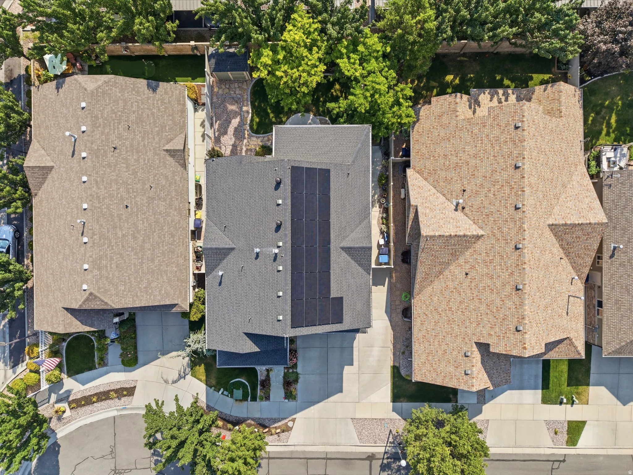 Aerial view showcasing three distinctive residences with modern architectural design