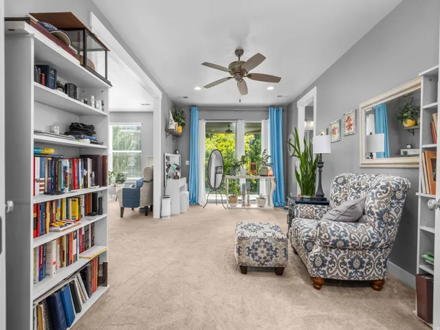 Light gray wall paint complemented by neutral-toned carpeting throughout