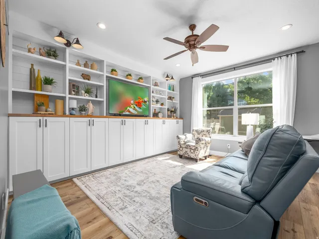 Integrated built-in cabinetry and shelving featuring a wood-finish countertop