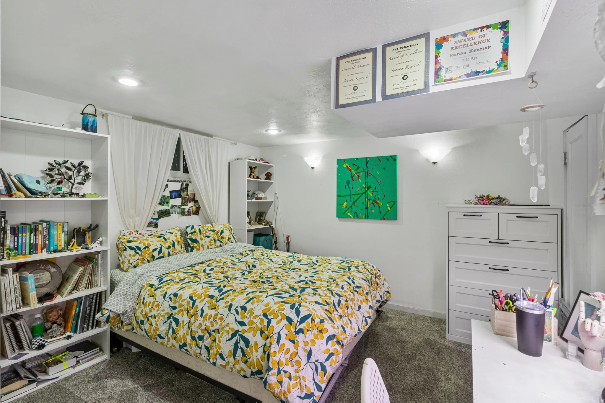 Carpeted room featuring recessed lighting, a window with white drapes, and built-in shelving