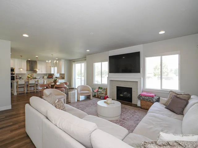 Open concept living area featuring wood-finish flooring
