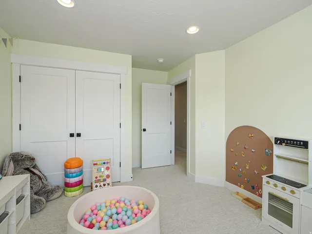 Recessed ceiling lighting, white painted trim, and light wall finishes
