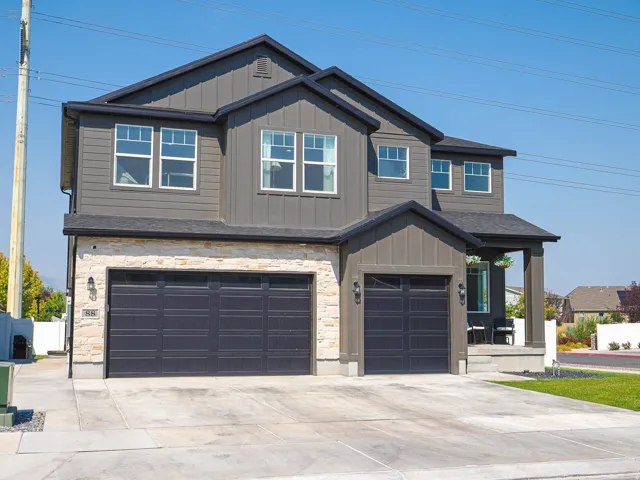 Stone veneer and vertical siding exterior