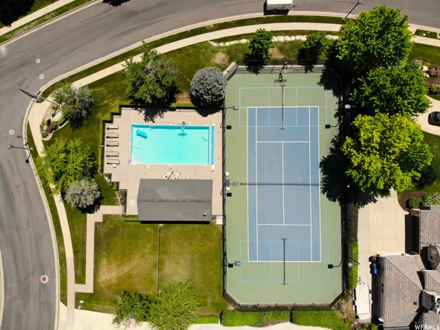Community amenities include a swimming pool, a tennis court, and a club house building