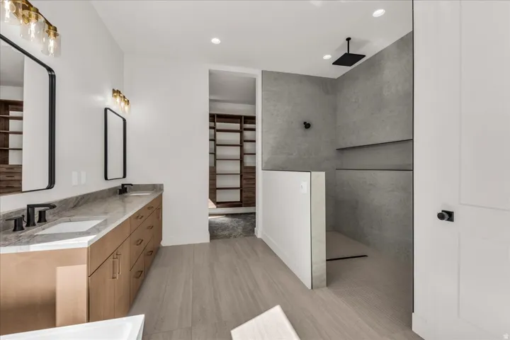 Dual vanity with a stone countertop and rectangular undermount sinks