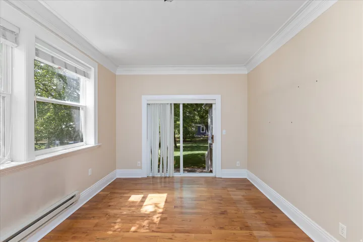Interior space featuring wood-finish flooring and light-toned walls