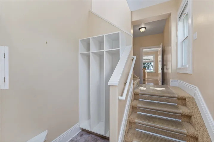 Carpeted staircase with clear step protectors