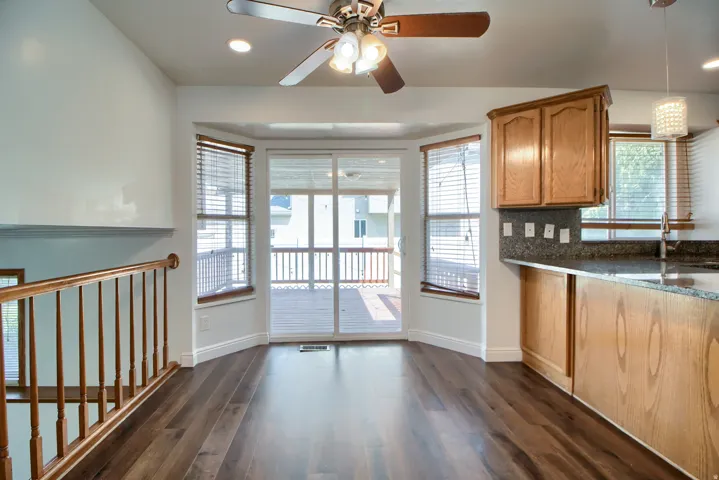 Open-concept living area featuring hardwood flooring, recessed lighting, and ceiling fan