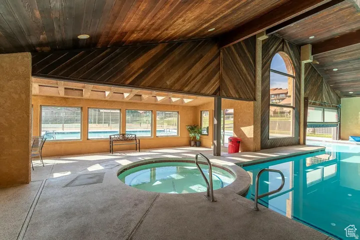 View of indoor pool and in-ground spa from Zillow