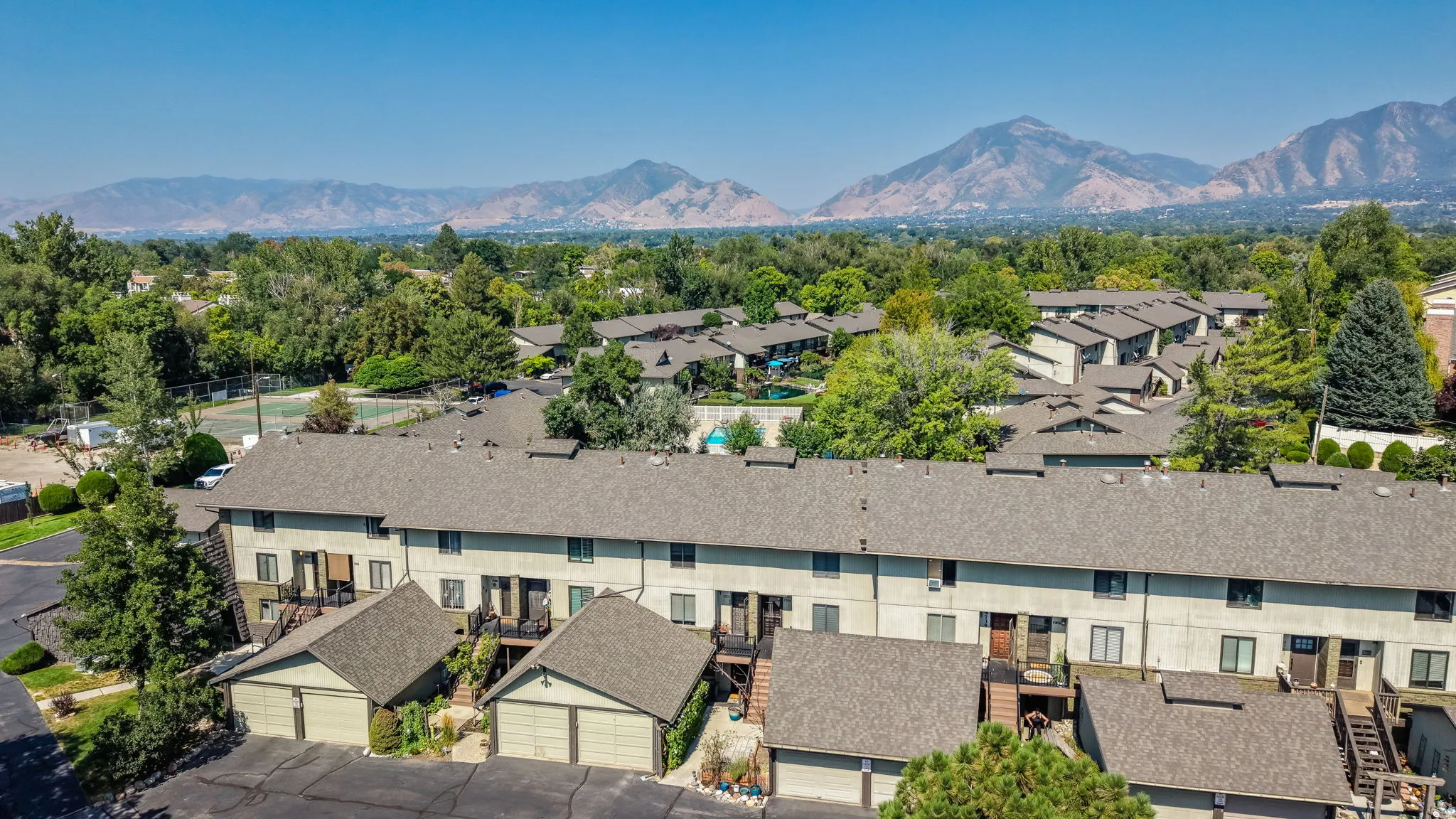 Multi-story townhome residences with attached garages and balconies
