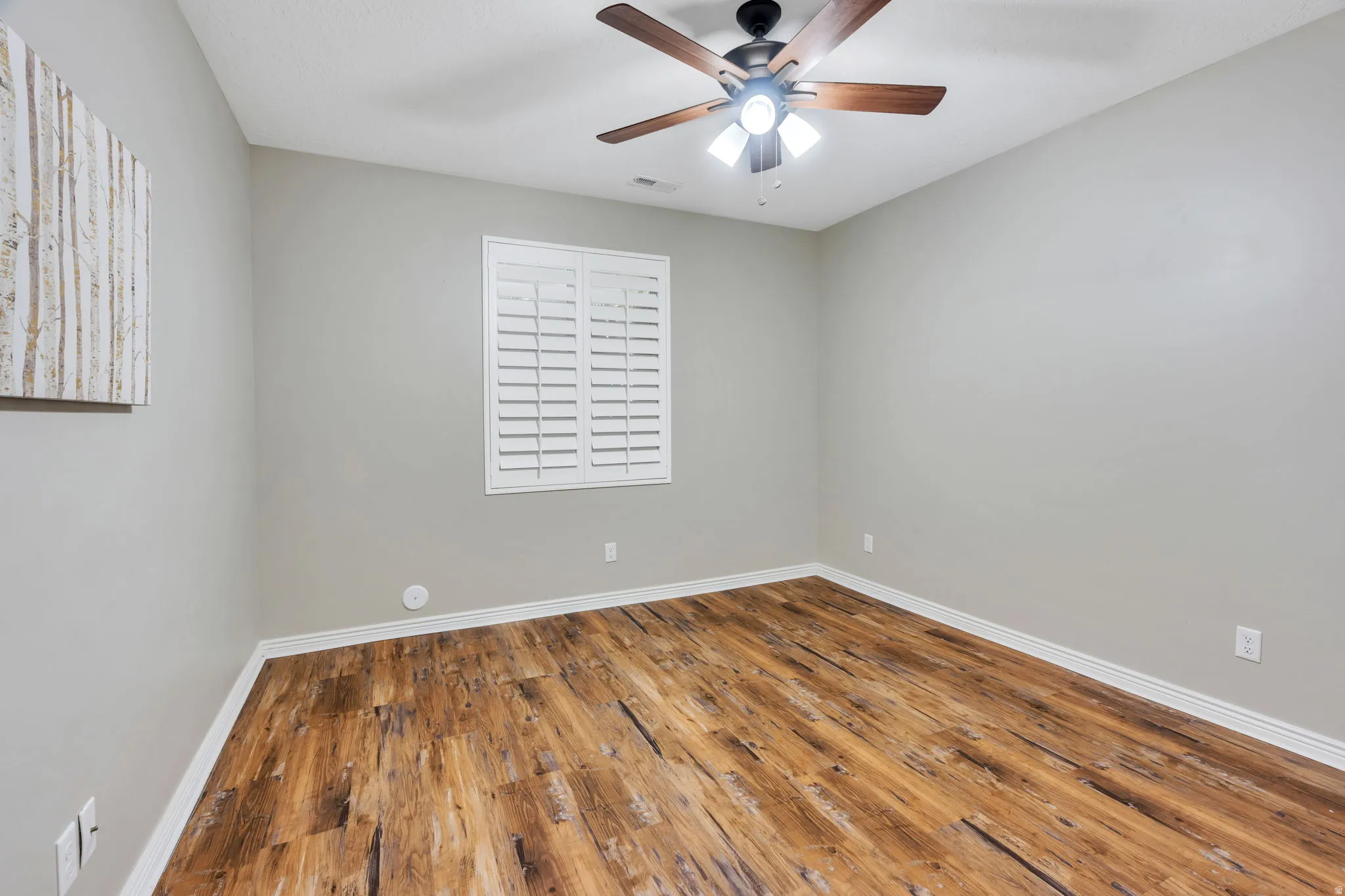 Neutral wall colors with wood-finish flooring