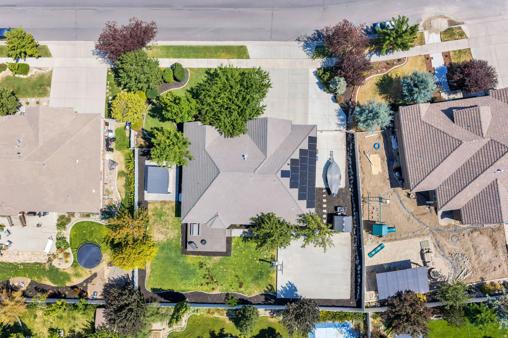 Contemporary residence featuring a multi-gabled roofline and solar panel array