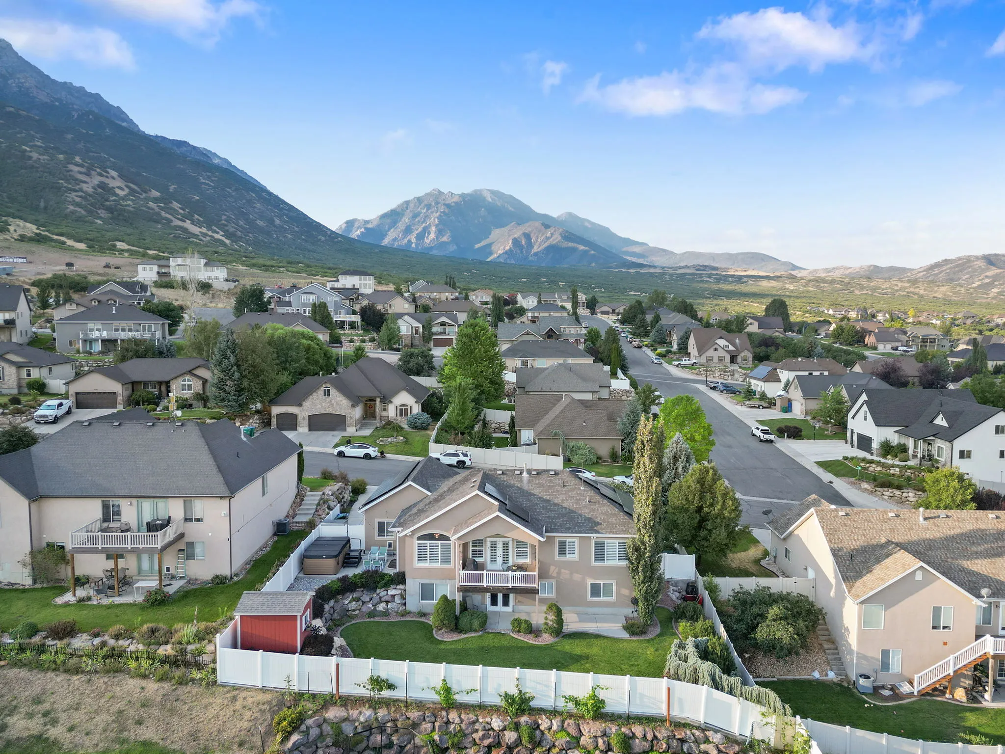 Expansive neighborhood setting with numerous properties, well-maintained streets, and mature landscaping