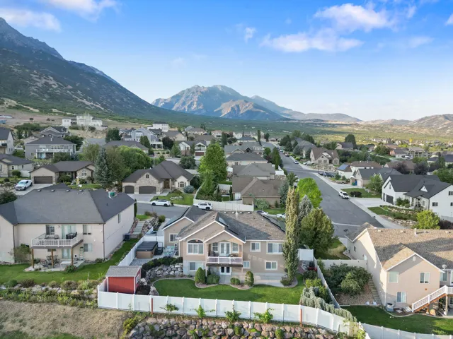 Expansive neighborhood setting with numerous properties, well-maintained streets, and mature landscaping