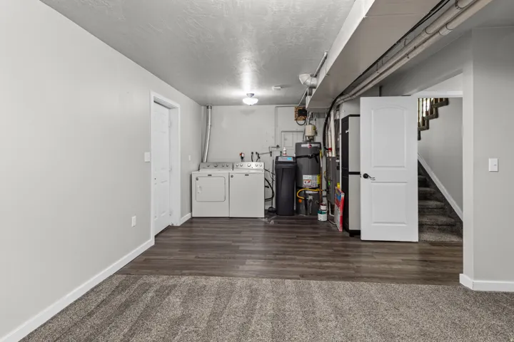 Carpeted and wood-finish flooring with neutral wall tones
