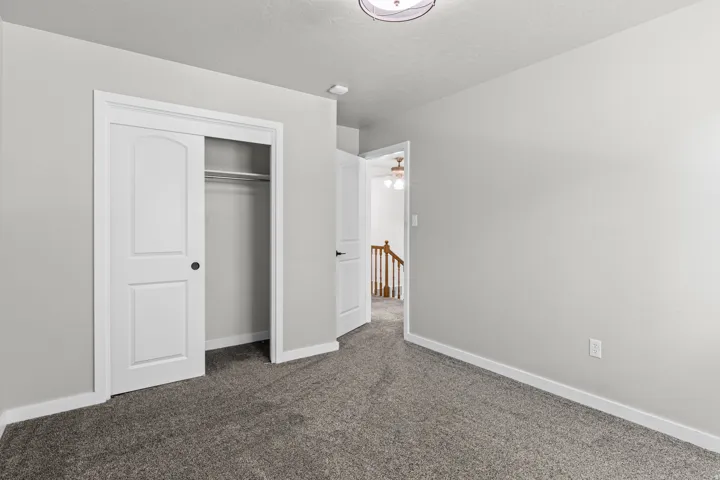 Wall-to-wall carpeting and neutral wall tones