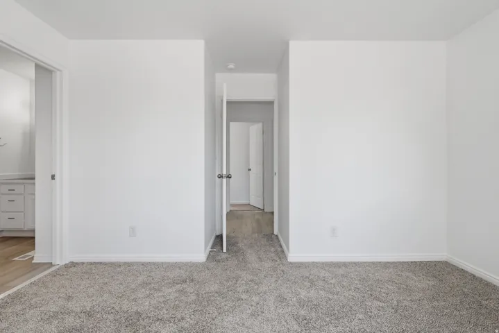 Neutral-toned carpeting throughout the main space