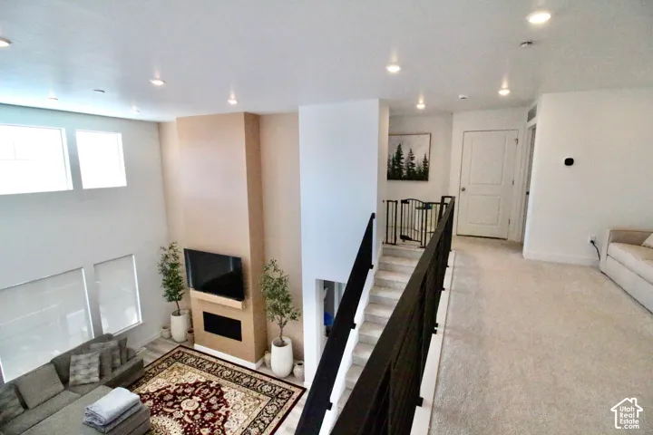 Two-story living area with high ceilings and recessed lighting