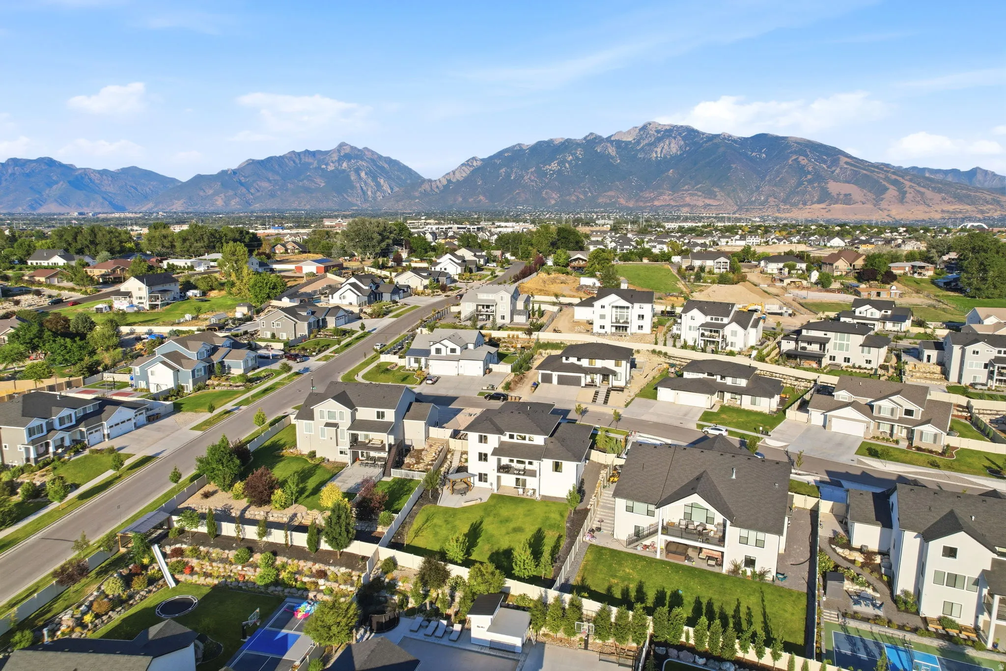 Prestigious residential community nestled against majestic mountain backdrop