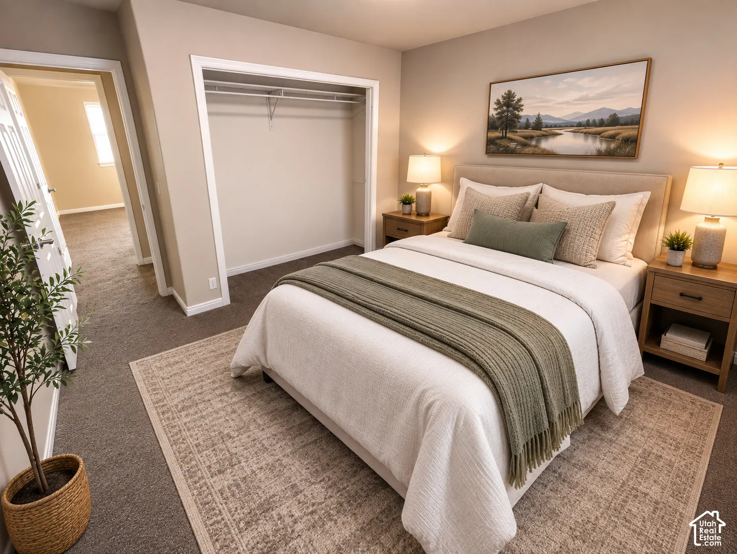 Carpeted flooring, neutral wall tones, and a built-in closet with shelving and hanging rod