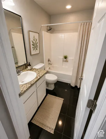 Modern bathroom featuring a white vanity with a round vessel sink and granite-look countertop, chrome faucet, and matching framed mirror