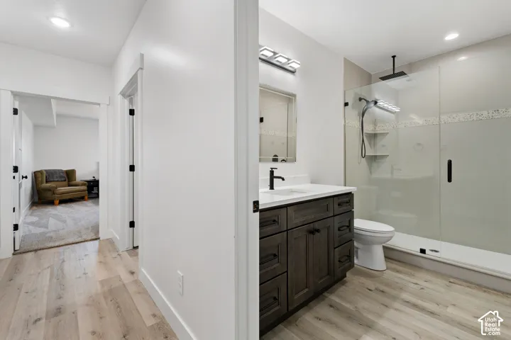 Bathroom featuring a dark wood-finish vanity with a white countertop and rectangular sink