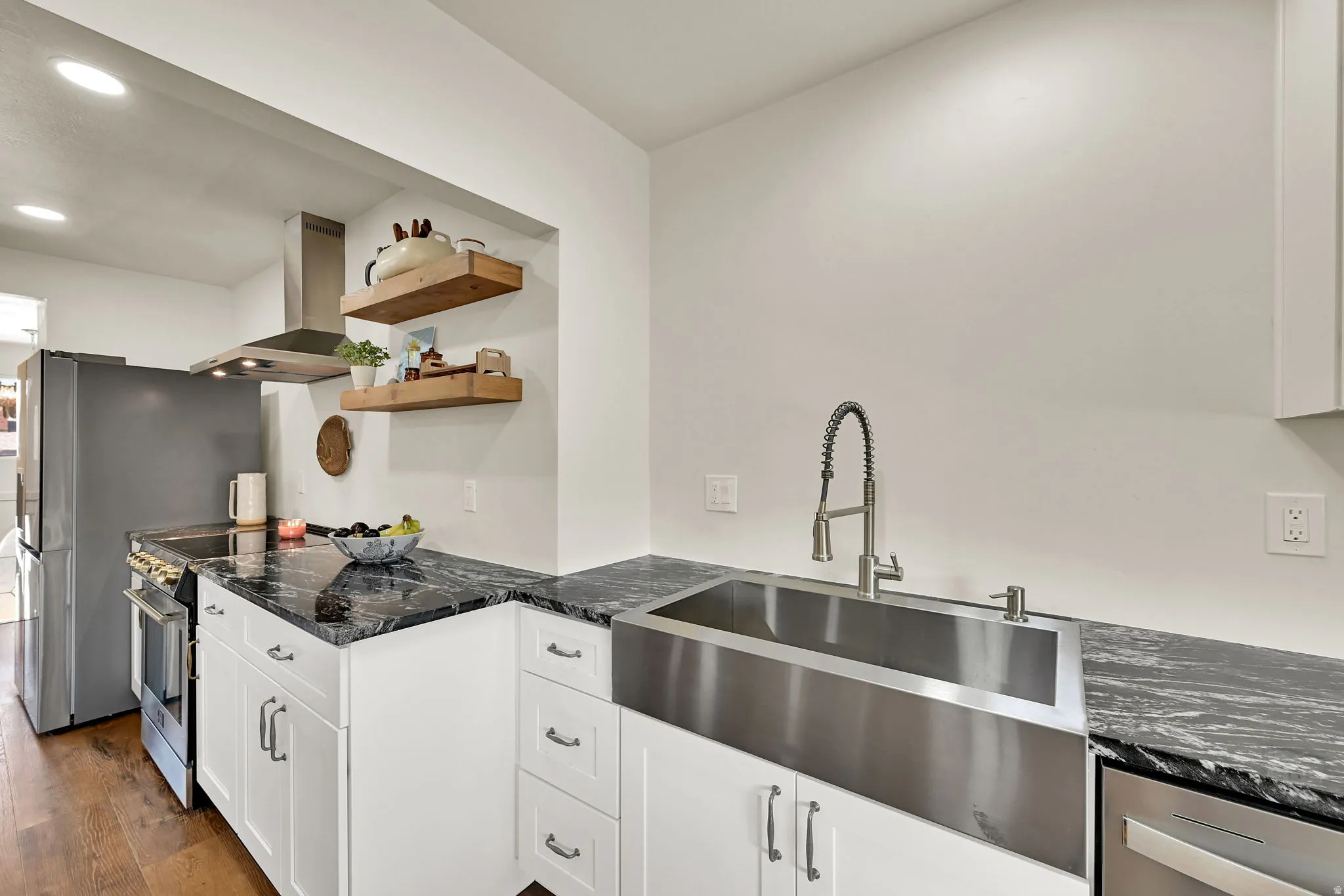 Stainless steel farmhouse sink with a gooseneck faucet