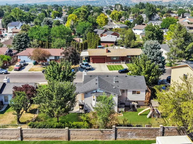 Charming single-story residence set on a generous lot featuring mature landscaping, manicured lawn, and established trees throughout the property