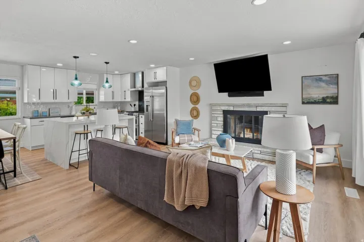 Open concept living area with wood-finish flooring