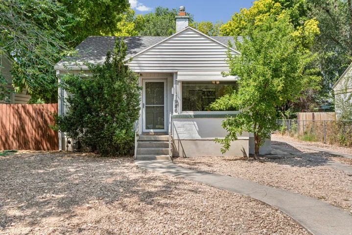 Charming Bungalow Residence with mature trees and xeri-scaped yard.