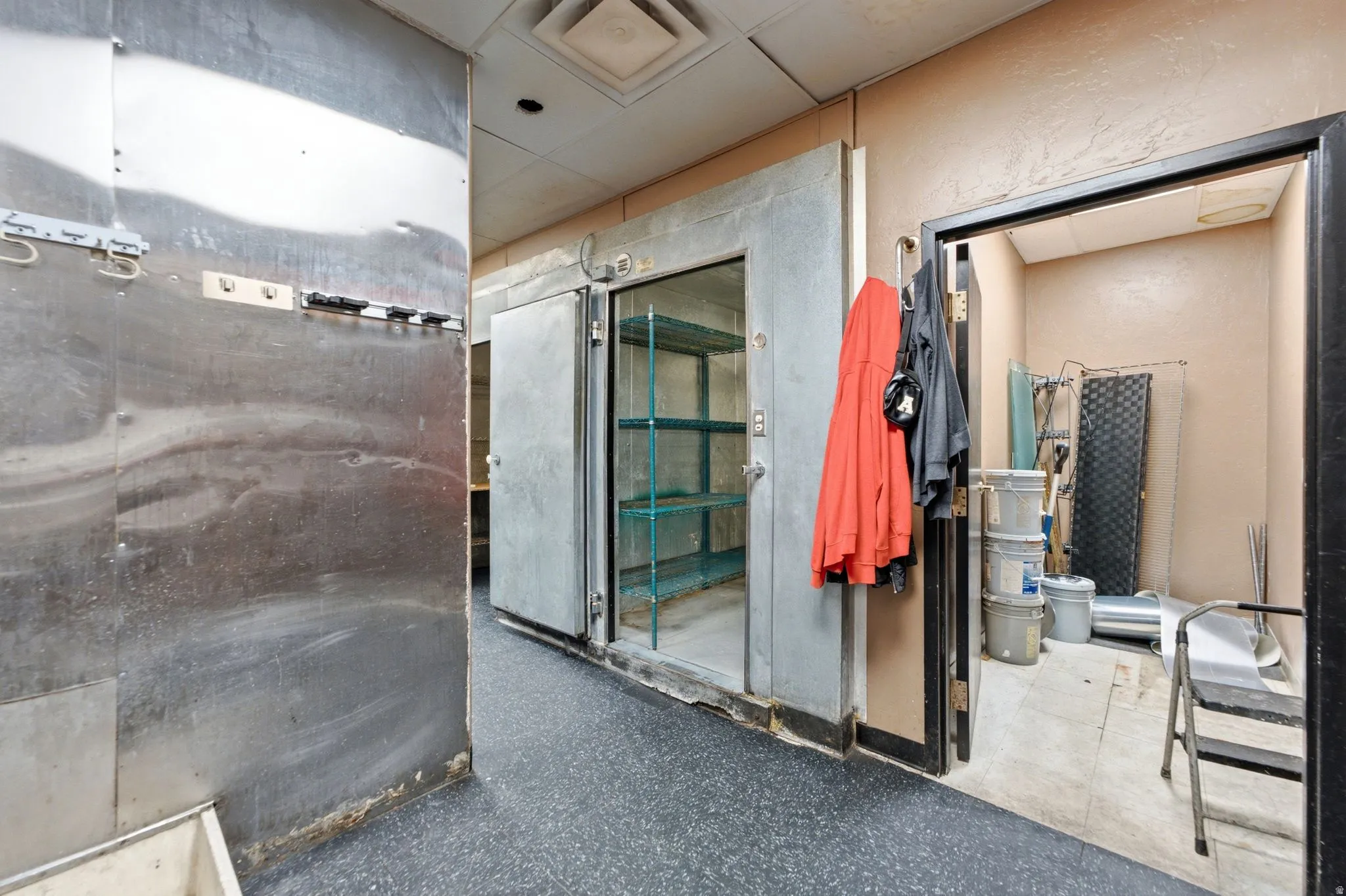 Managers office next to walk-in freezer and walk-in fridge