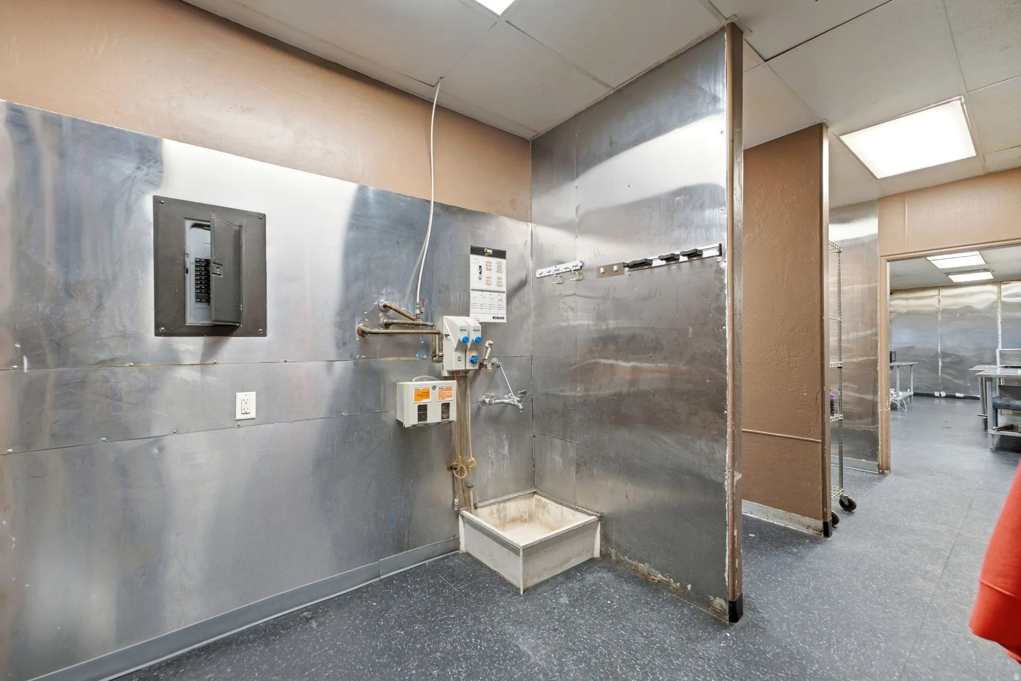 Janitors closet with mop bucket station