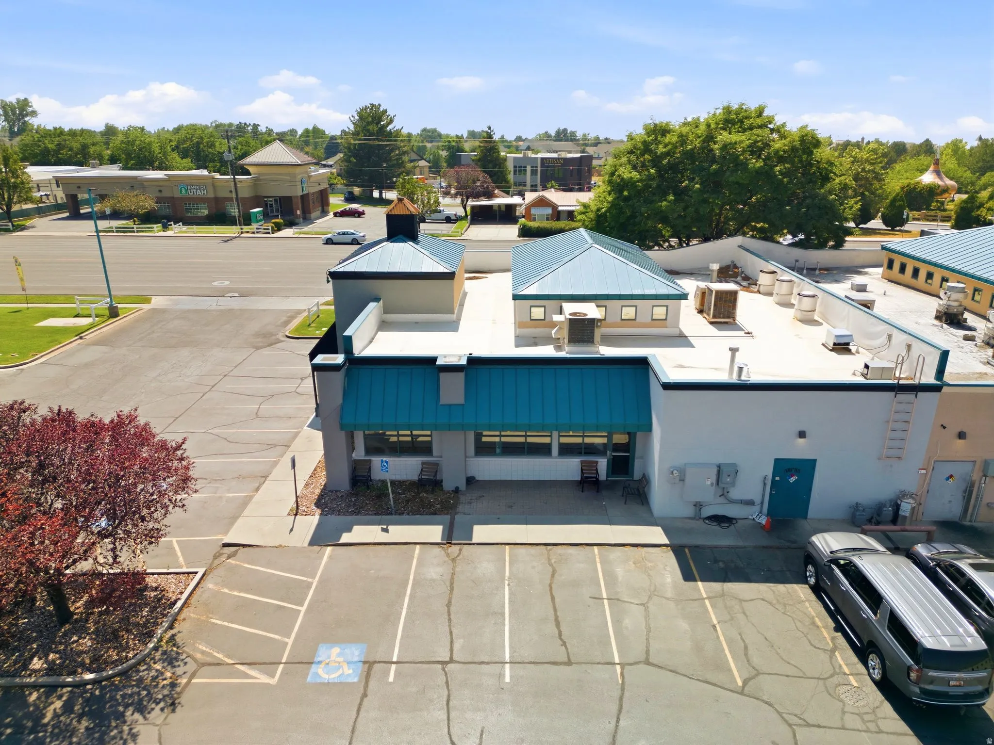 Commercial building with multiple rooflines and a prominent metal awning