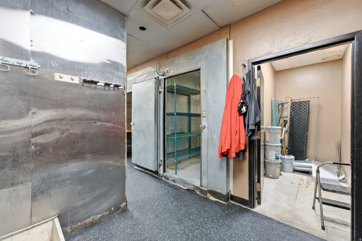 Managers office next to walk-in freezer and walk-in fridge