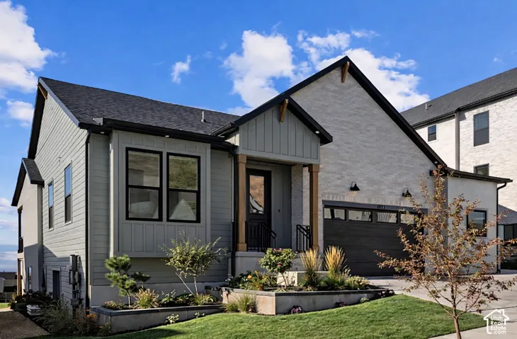 AI Rendering of home featuring actual color scheme.  Rendering created from previously built Fieldcrest farmhouse plan.  This rendering does not account for the 3rd Car bay that the actual home will include.