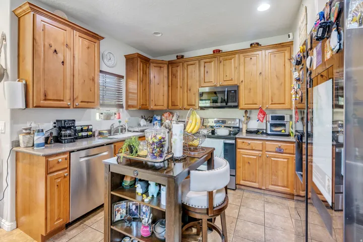 Wood-finish cabinetry paired with stainless steel appliances