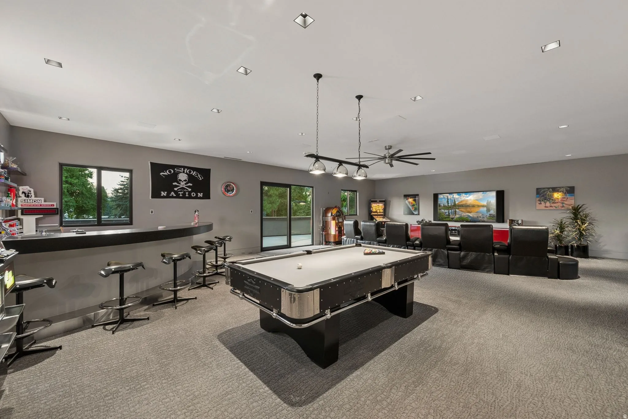 Recreation room featuring a built-in bar, recessed lighting, and a ceiling fan