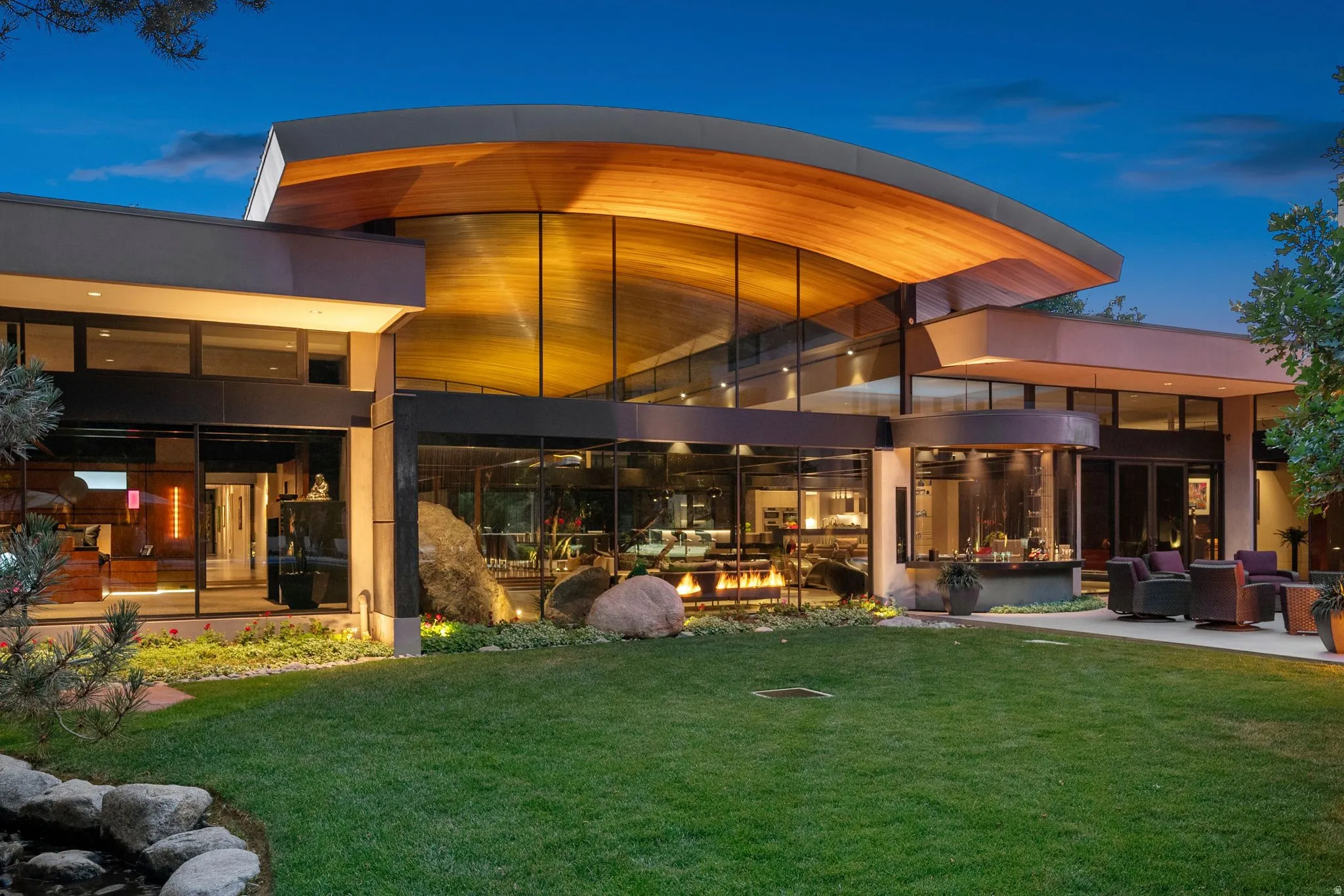Modern architectural design with a curved wood-finish ceiling