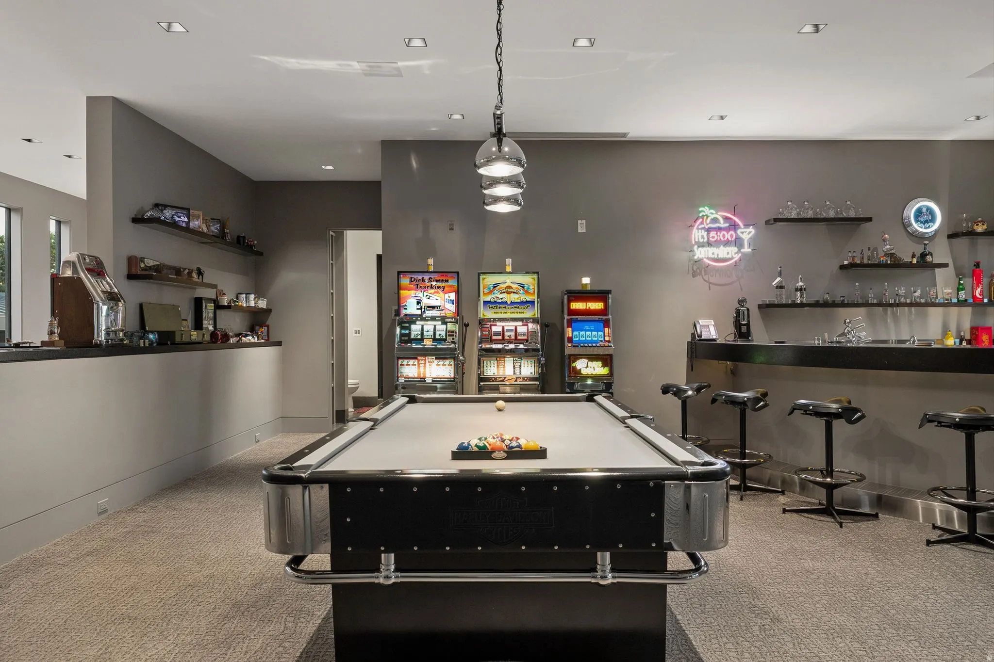 Recreational room featuring a pool table, two built-in bars, and recessed lighting