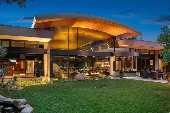 Modern architectural design with a curved wood-finish ceiling