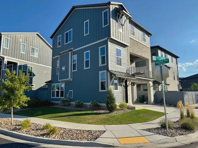 Multi-story exterior with modern siding and stone accents