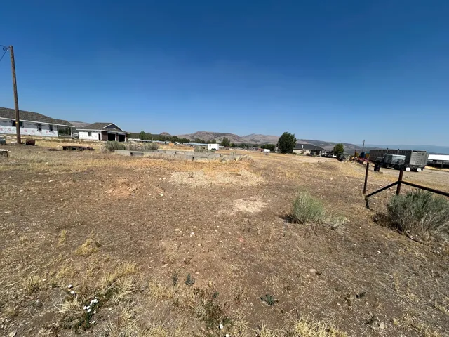 Expansive undeveloped parcel with a clear sky backdrop