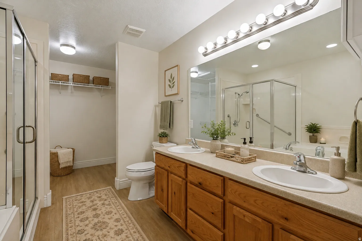 Double doors take you to this large full bath off the primary bedroom with LVP wood flooring.   Virtually staged to show possibilities.