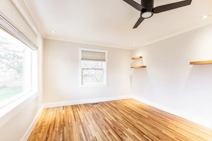 Wood-finish flooring, recessed lighting, and a modern ceiling fan