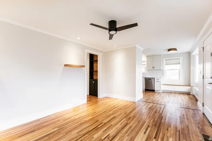 Hardwood flooring throughout, recessed lighting, and a contemporary ceiling fan