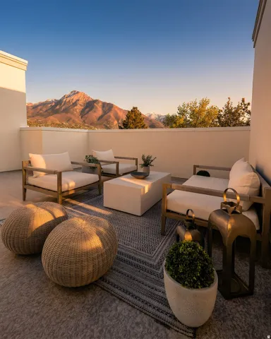 Expansive outdoor terrace featuring mountain scenery and a low-rise perimeter wall