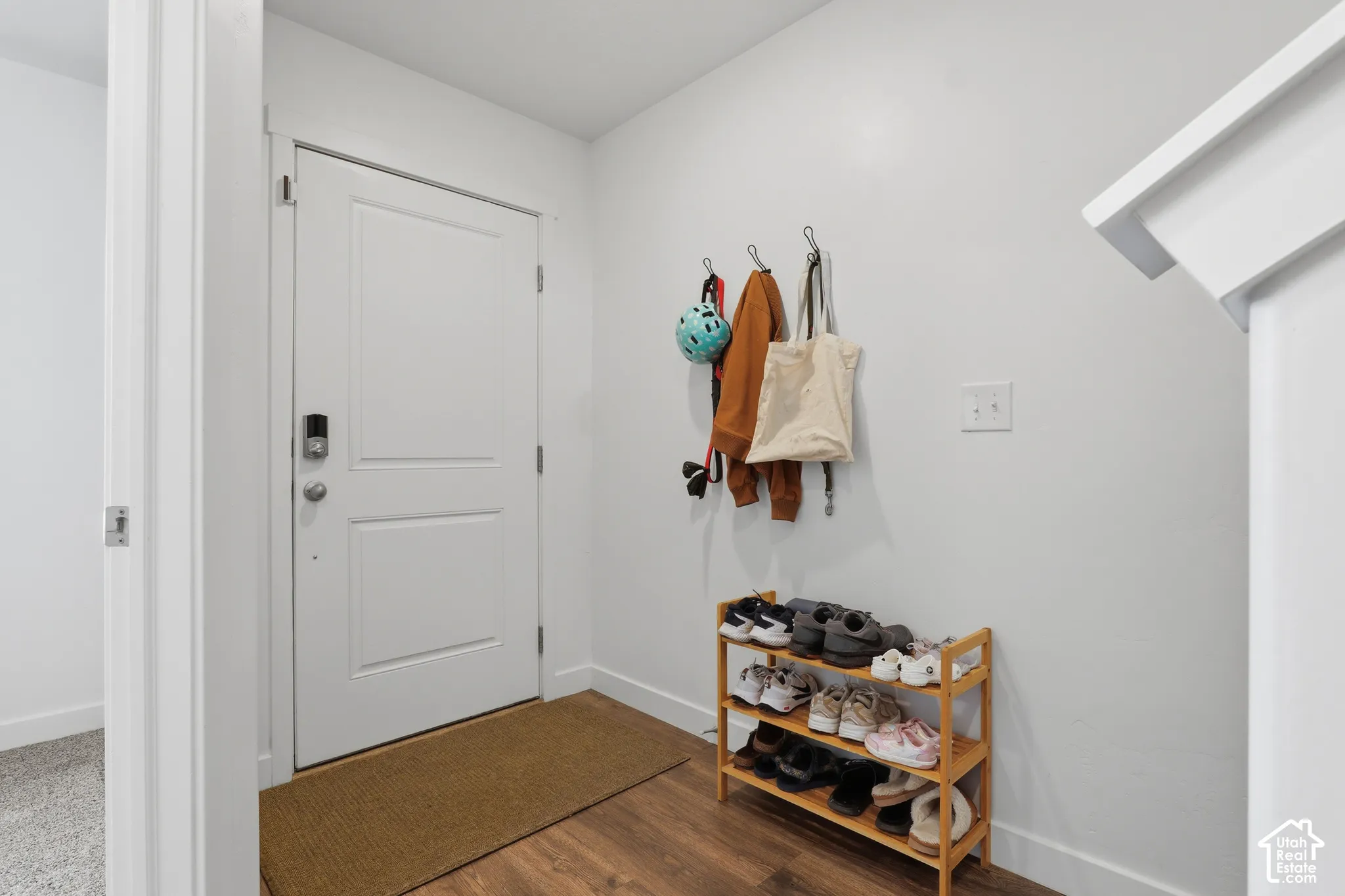 Wood-finish flooring with crisp white walls and white trim