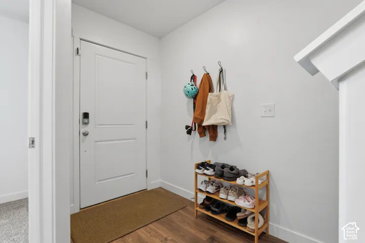 Wood-finish flooring with crisp white walls and white trim